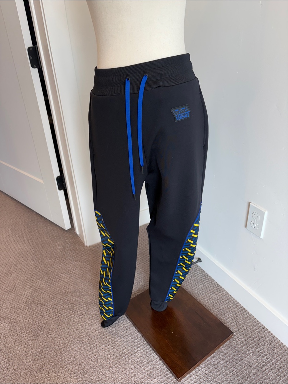 Versace Black Track Pants with Blue and Yellow Accents - Picture 1 of 5